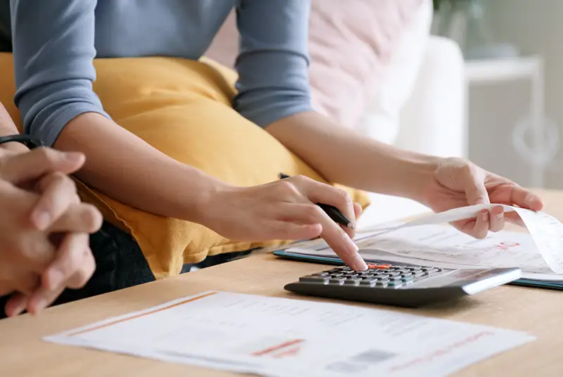 A person calculating their finances